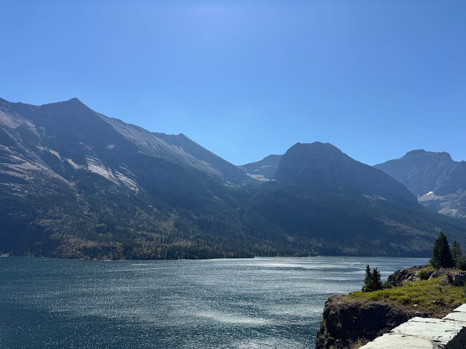 A glacial lake below the mountains of Glacier National Park, Montana, where the First Coast Roofing crew spends its annual company trip
