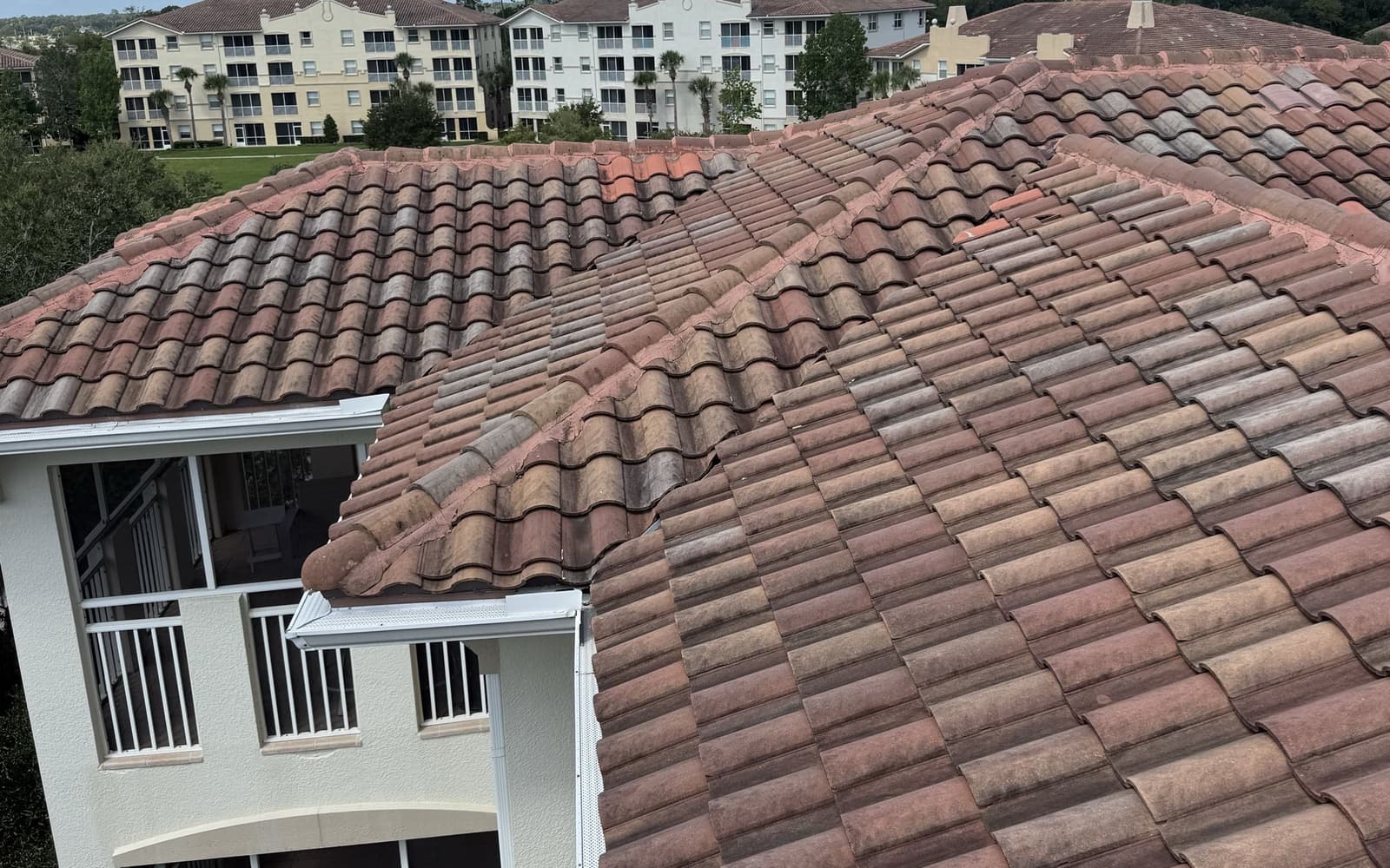 Barrel tile roof photographed from the ridge during a roof inspection